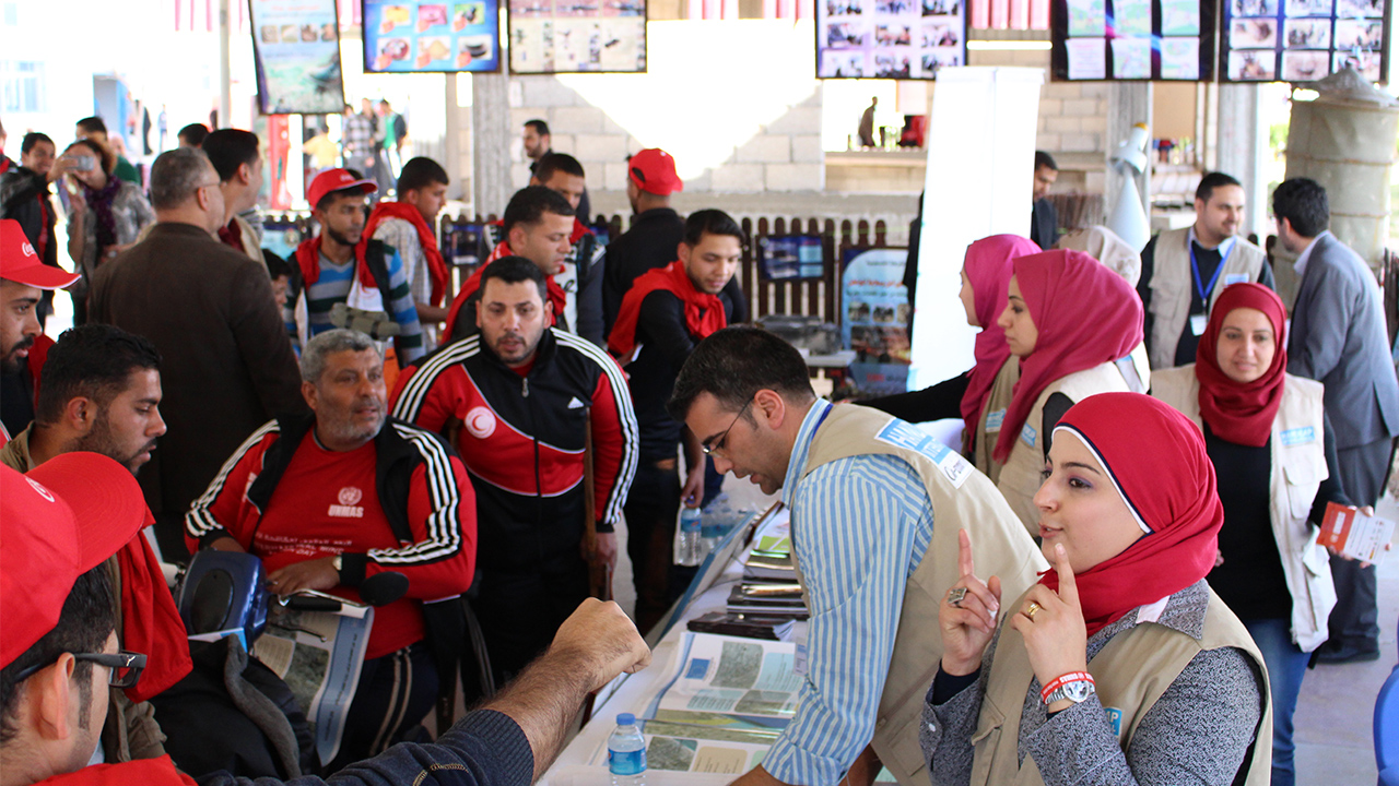 HI's information stand at an event in Gaza, April 2015